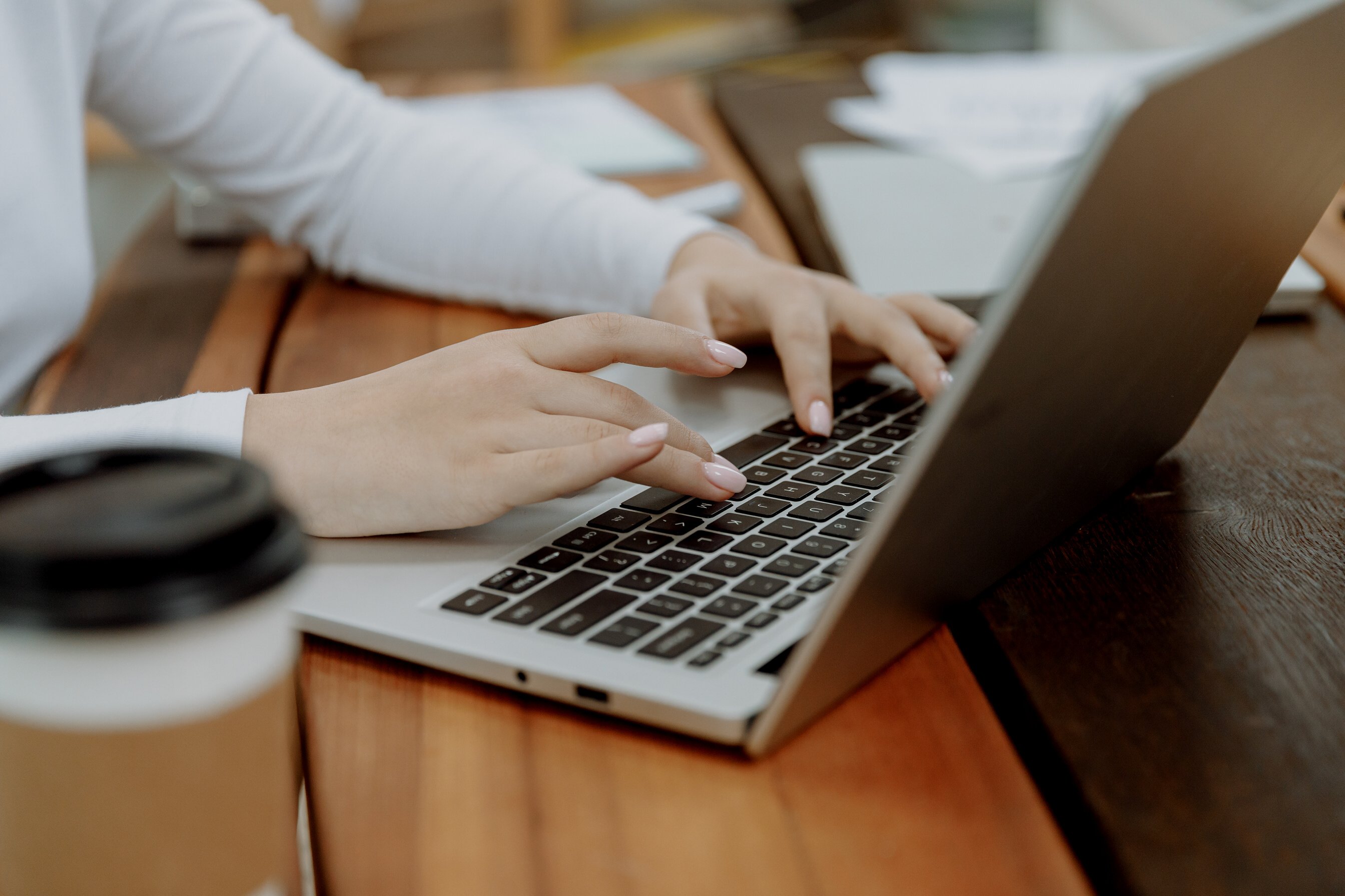 Woman Typing on Laptop